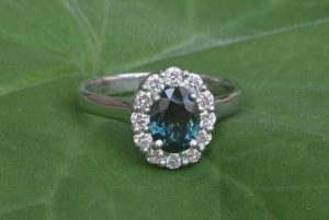 Ring image. Handmade halo style with Central Queensland oval parti sapphire and 1.9mm Argyle diamonds in the halo. By Ethical Jewellery Australia