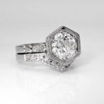 Side on view of a 1.35 carat vintage diamond recycled platinum engagement ring in a hexagonal setting, with matching fitted wedding ring