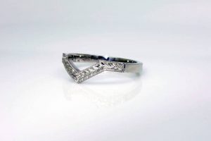 Photo of a recycled platinum fitted wedding ring with wheat sheaf engraving