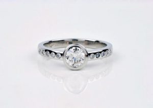 Bezel set lab-diamond engagement ring in recycled platinum