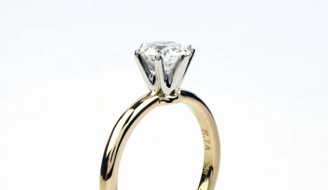 Lab-created diamond engagement ring . The 6-claw setting is recycled platinum on a recycled 18 carat gold band